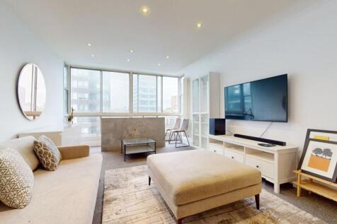 Bright lounge with floor-to-ceiling windows...