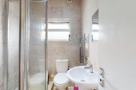 Bright, modern bathroom with a walk-in shower, ...
