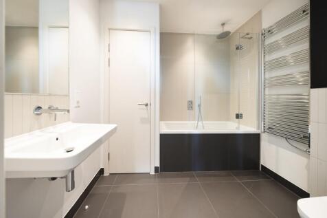 Experience luxury and comfort in this sleek modern bathroom.