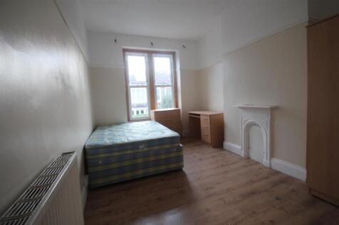 Bright and airy double bedroom featuring a comf...