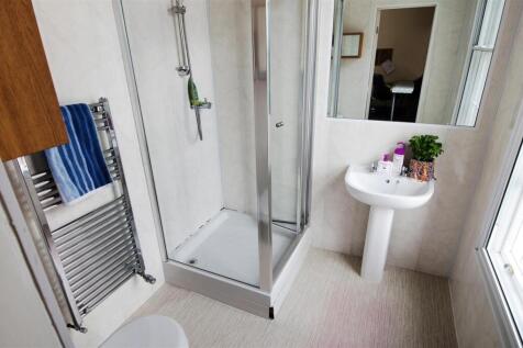 Modern bathroom with large walk-in shower...