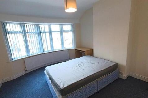 Bright master bedroom with large bay window...