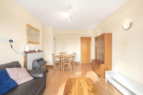 Spacious living room with natural light...