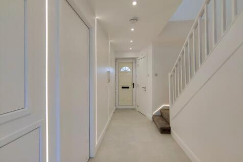 Bright and modern entryway with sleek LED desig...