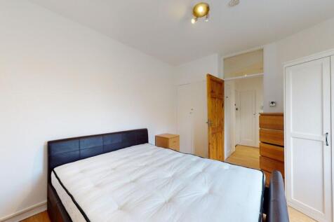 Bright double bedroom with ample storage space...
