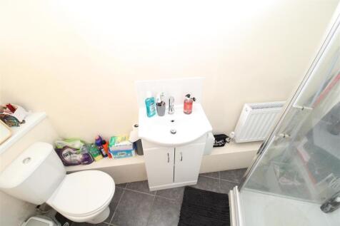 Bright bathroom with modern white vanity unit...