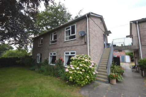 Brick two-storey property with external stairca...