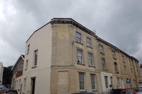 Historic terraced building with on-street parki...