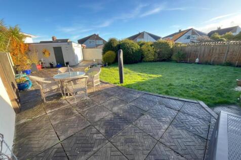 Rear garden, patio and garage.jpg