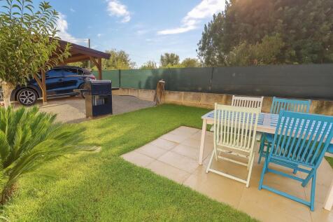 The barbecue area and the covered parking spaces
