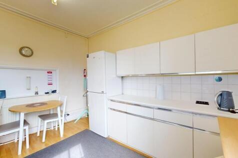 Bright kitchen with ample storage and dining ar...