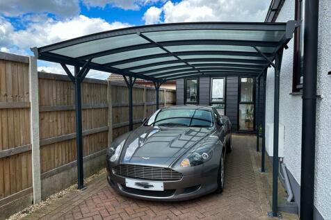 CAR PORT &amp; GATED PARKING AREA