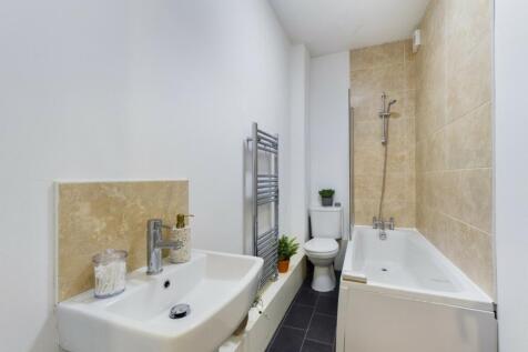 A modern and well-maintained bathroom featuring...