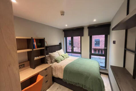 Our Classic Ensuite rooms (11-12 sqm) are designed to feel bright, comfortable, and cleverly laid out. The bed is a small double and is positioned beside the floor to ceiling window, making the most o