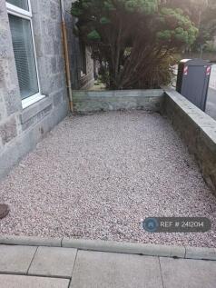 Gravelled Outdoor Area With Stone Walls