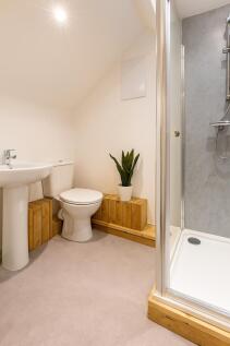 Bright and tidy bathroom with a modern shower, ...