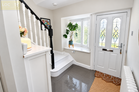 Bright Modern Entryway with Stained-Glass Door