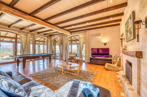 Living area with floor to ceiling windows