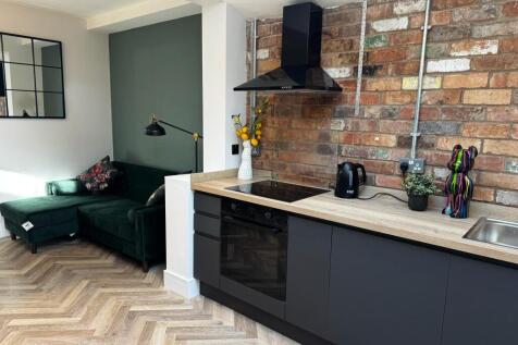 Modern kitchen with chic exposed brick walls...