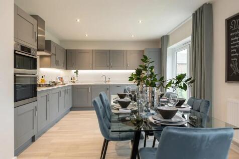 A modern and stylish kitchen with gray cabinets