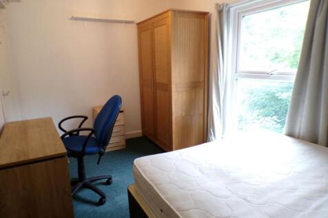 Bright bedroom with a large window bringing in ...