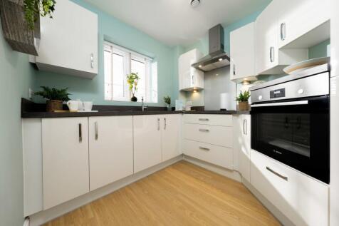 a kitchen with white cabinets