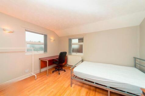 Bright room with bed and study area...