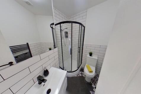 Modern bathroom with sleek black accents...