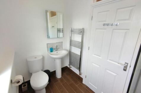 Bright, modern bathroom with white sanitaryware...