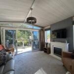 Bright Lodge Lounge With Patio Doors Opening Onto 