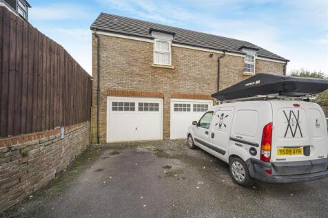 Double garage under coach house