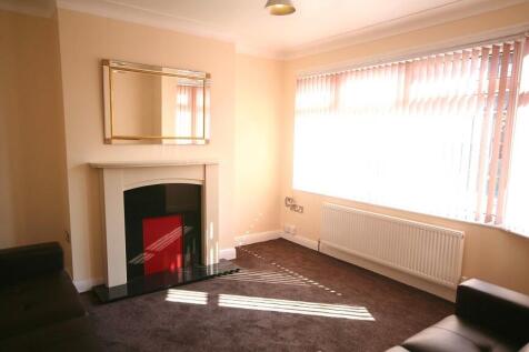 Bright and spacious living room featuring a lar...
