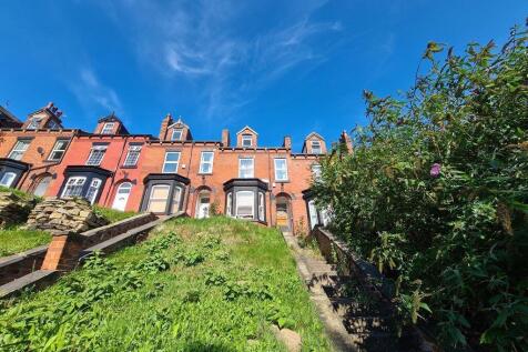 A charming row of classic terraced houses viewe...