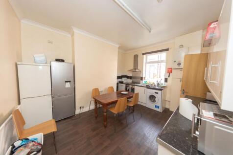 A spacious and functional kitchen featuring a w...