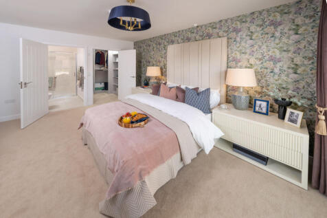 Show home bedroom, also showing ensuite and walk in wardrobe
