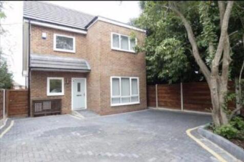 Modern detached home with large paved driveway...