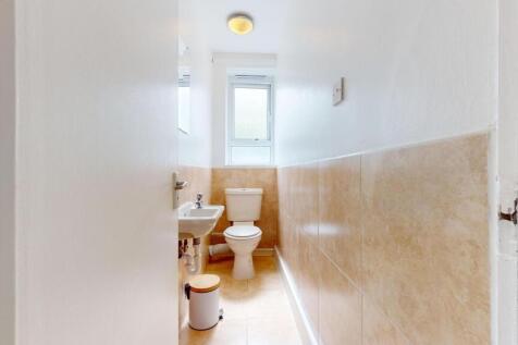 Bright and tidy WC with natural light window...