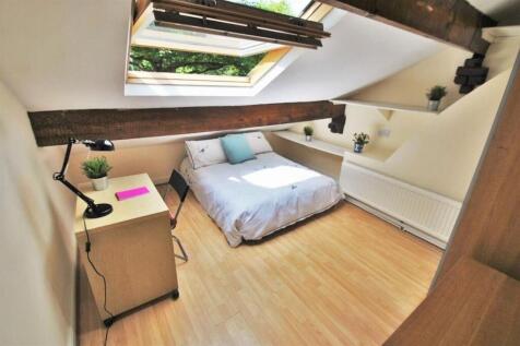 Bright attic bedroom with double bed and desk...