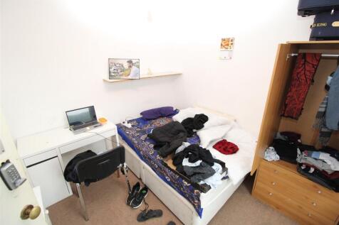 Bright bedroom with ample storage and desk...