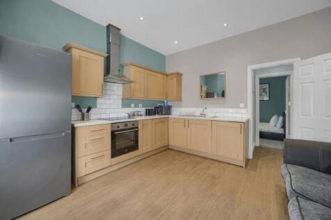 Modern kitchen with stylish units and appliance...