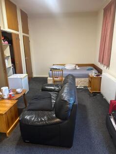 Well-laid-out room with a comfortable leather s...