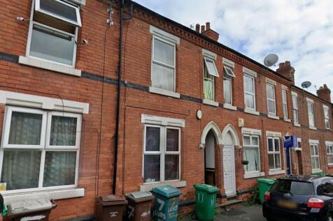 Charming red brick terraced house exterior...
