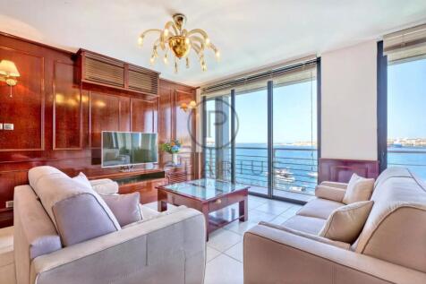 Spacious living room with floor-to-ceiling windows