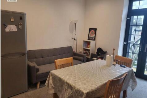 Bright lounge with dining table and sofa...
