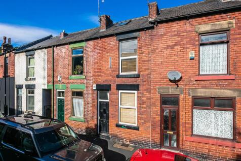Charming red brick terraced home in bright sun...