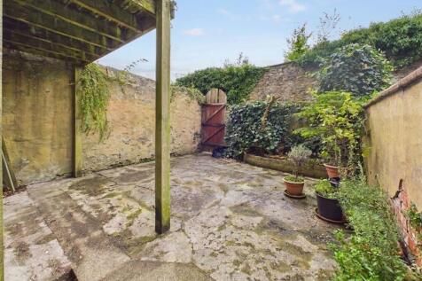 Enclosed Rear Yard with Sheltered Seating Area