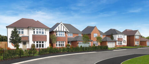 Modern suburban houses with varied brick and white exteriors, lush gardens, and a curved road under