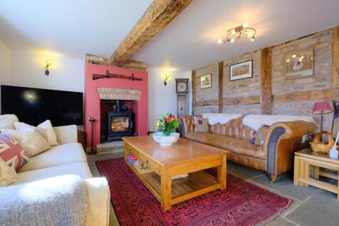 Welcoming sitting room with log burner