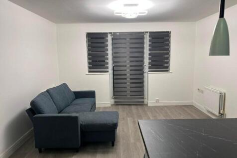 Contemporary open-plan living area with a comfo...