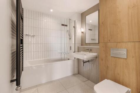 Experience the blend of style and function in this chic bathroom.